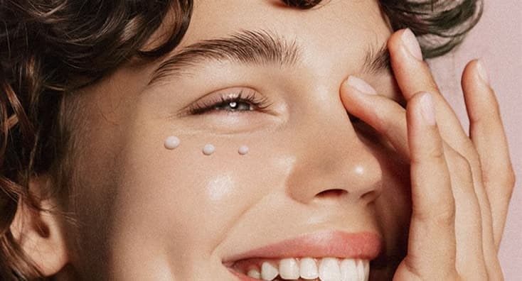 Three dots of serum laid along the skin under one eye.